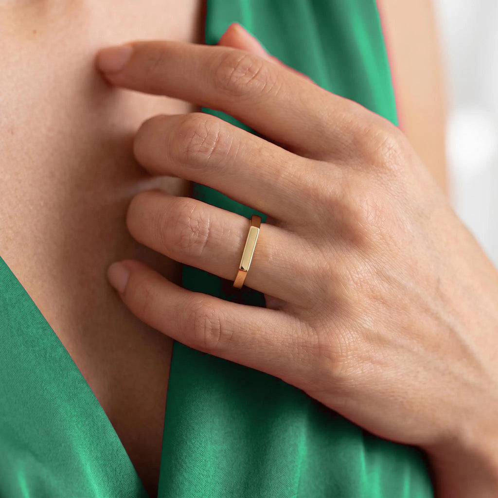 Gold bar signet ring worn as everyday ring