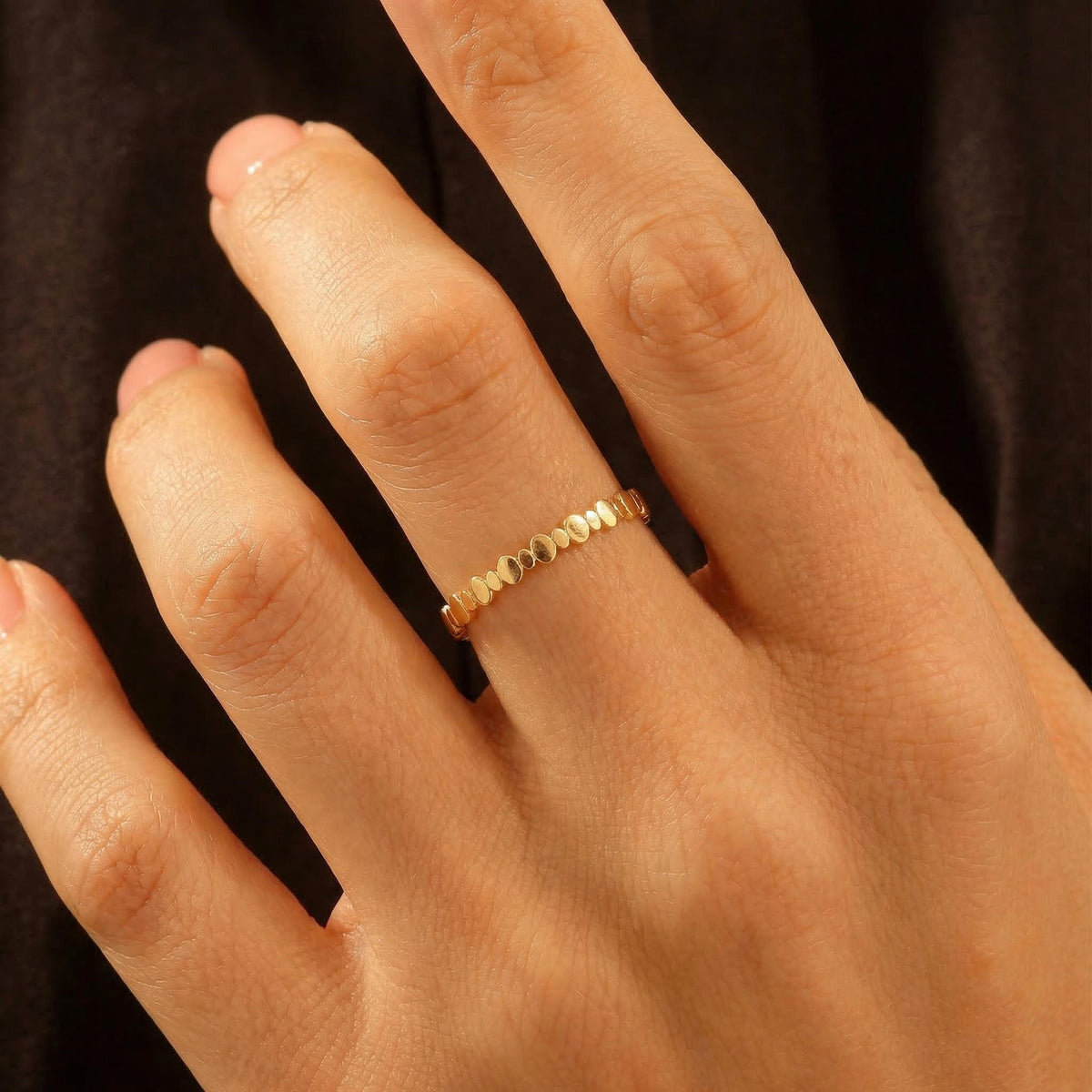 Beaded ring worn on the hand