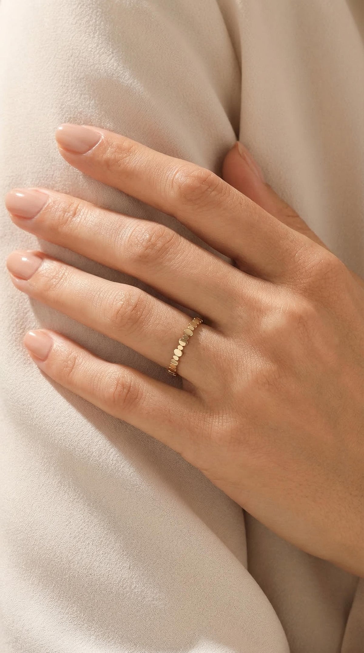 Beaded ring on a resting hand