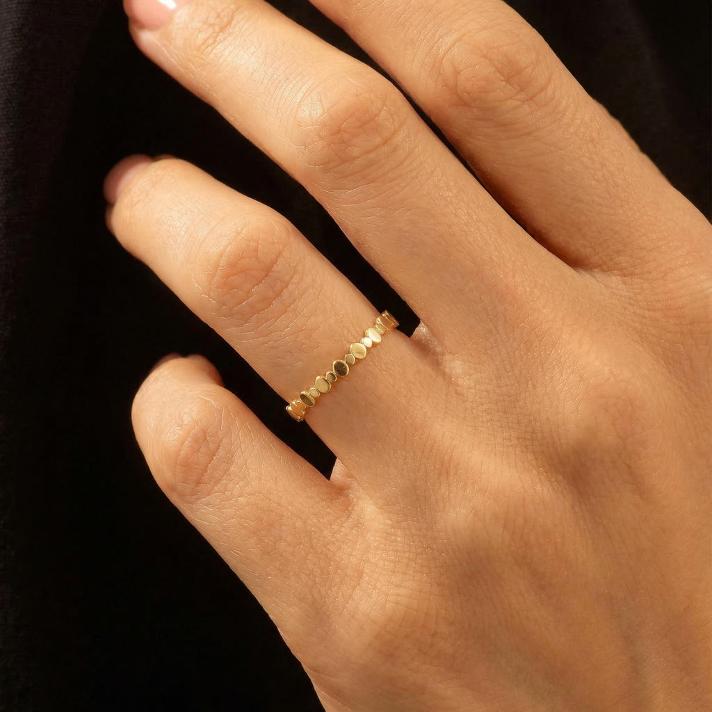 Beaded ring on the finger