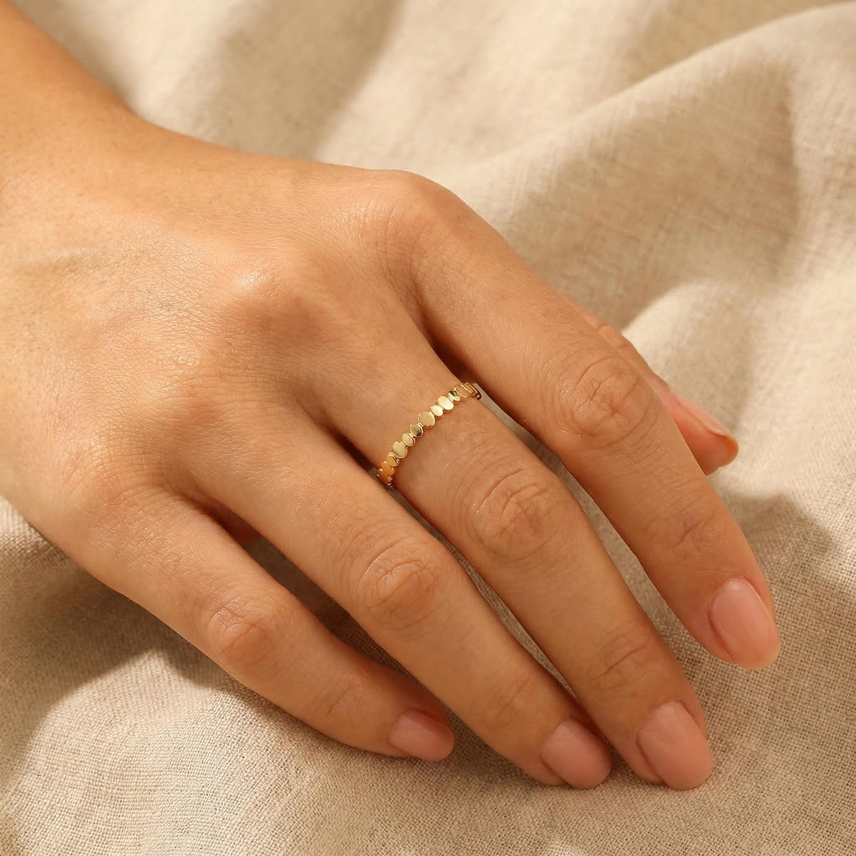 Minimalist beaded gold ring worn