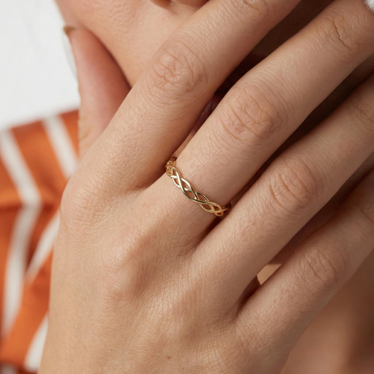 Celtic braided ring styled on hand