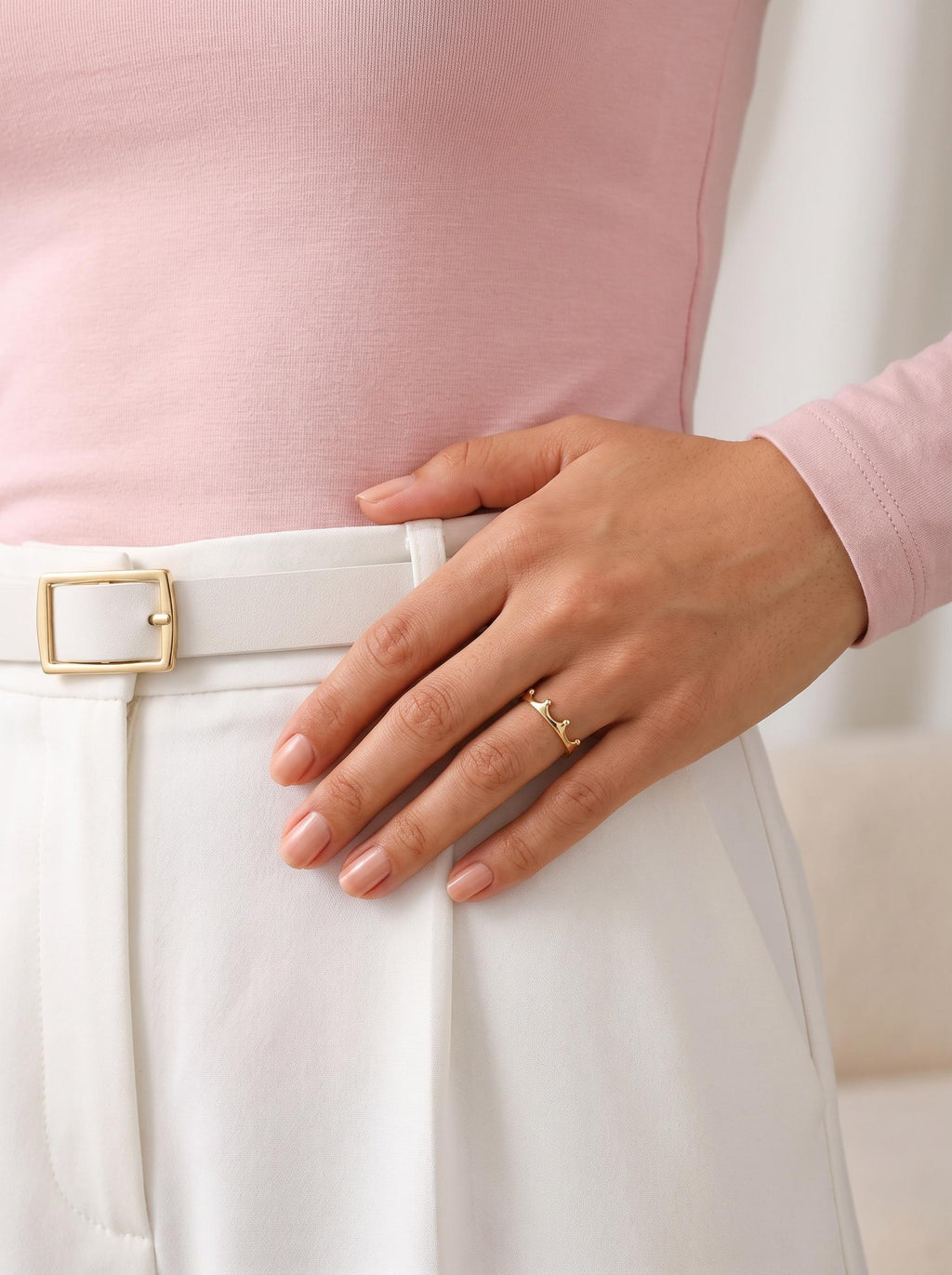 Minimalist crown ring styled with white trousers