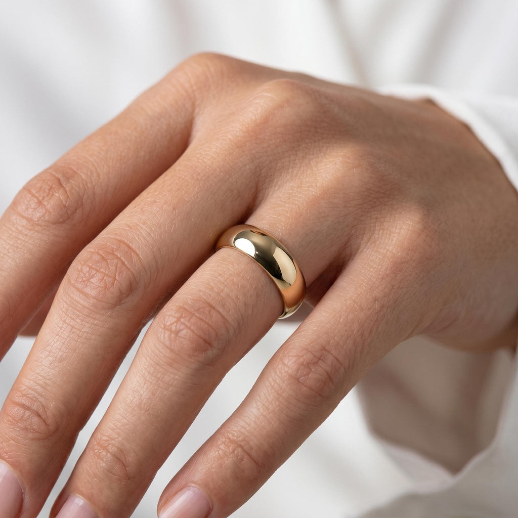 Dome wedding band worn on the hand