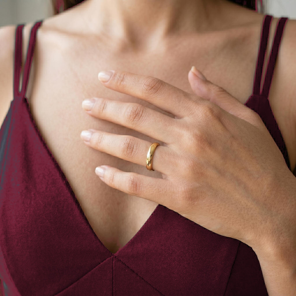 Polished dome band worn on hand