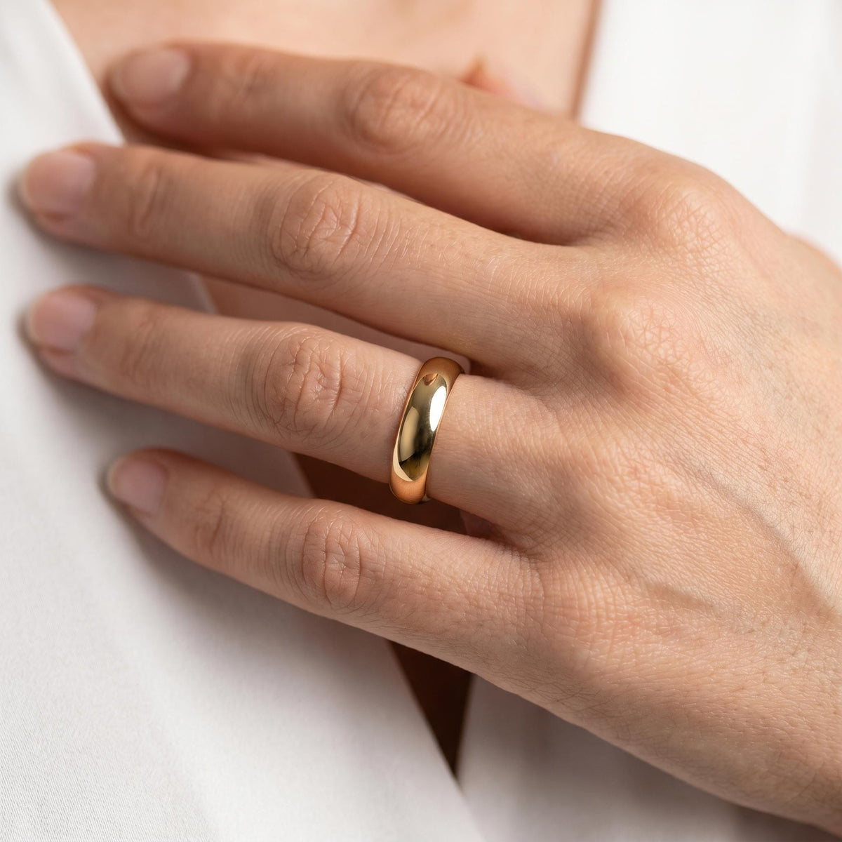 Classic polished dome band on the hand