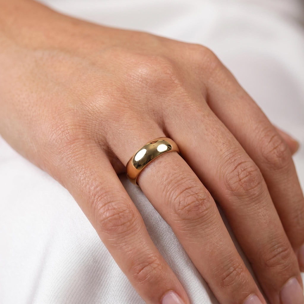 Yellow gold dome wedding ring worn