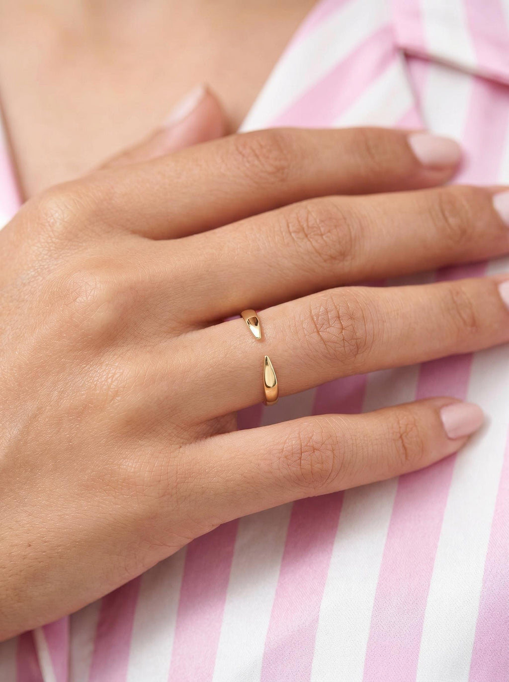 Open cuff ring on the finger
