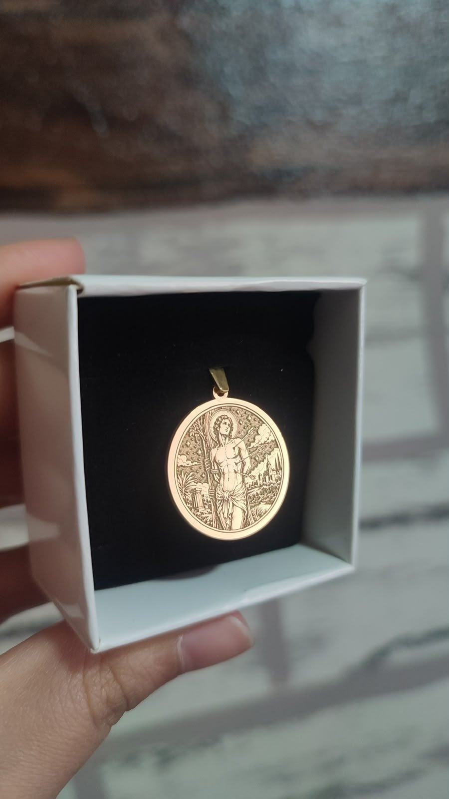 Saint Sebastian medallion in gold