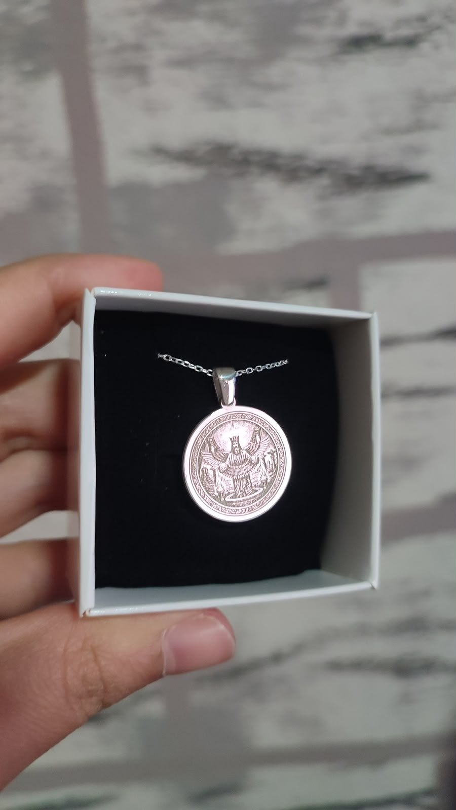 Winged king medallion in silver