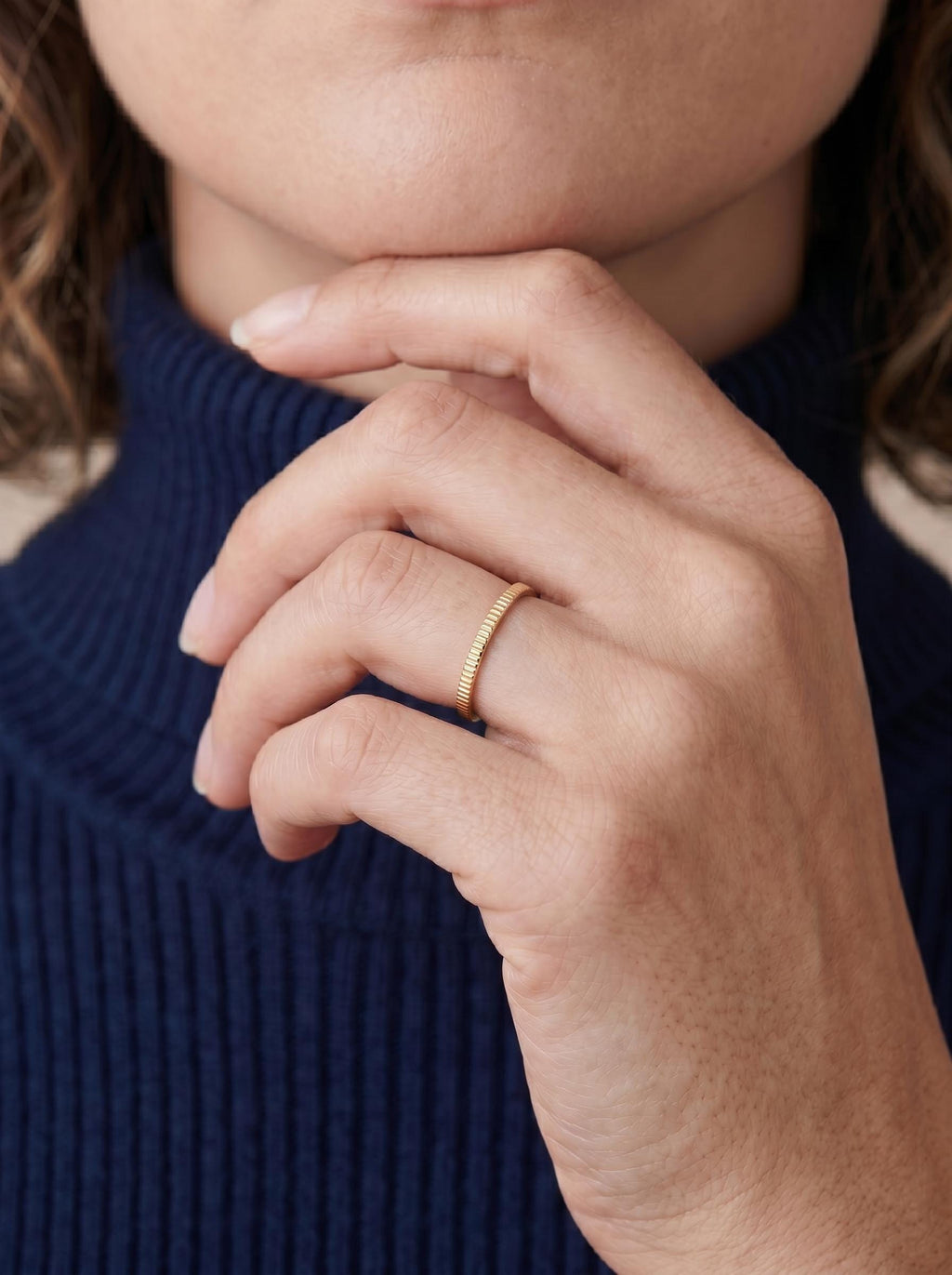 Ribbed stacking ring on the finger