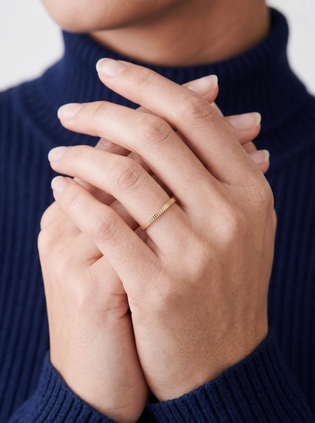 Ribbed band on clasped hands