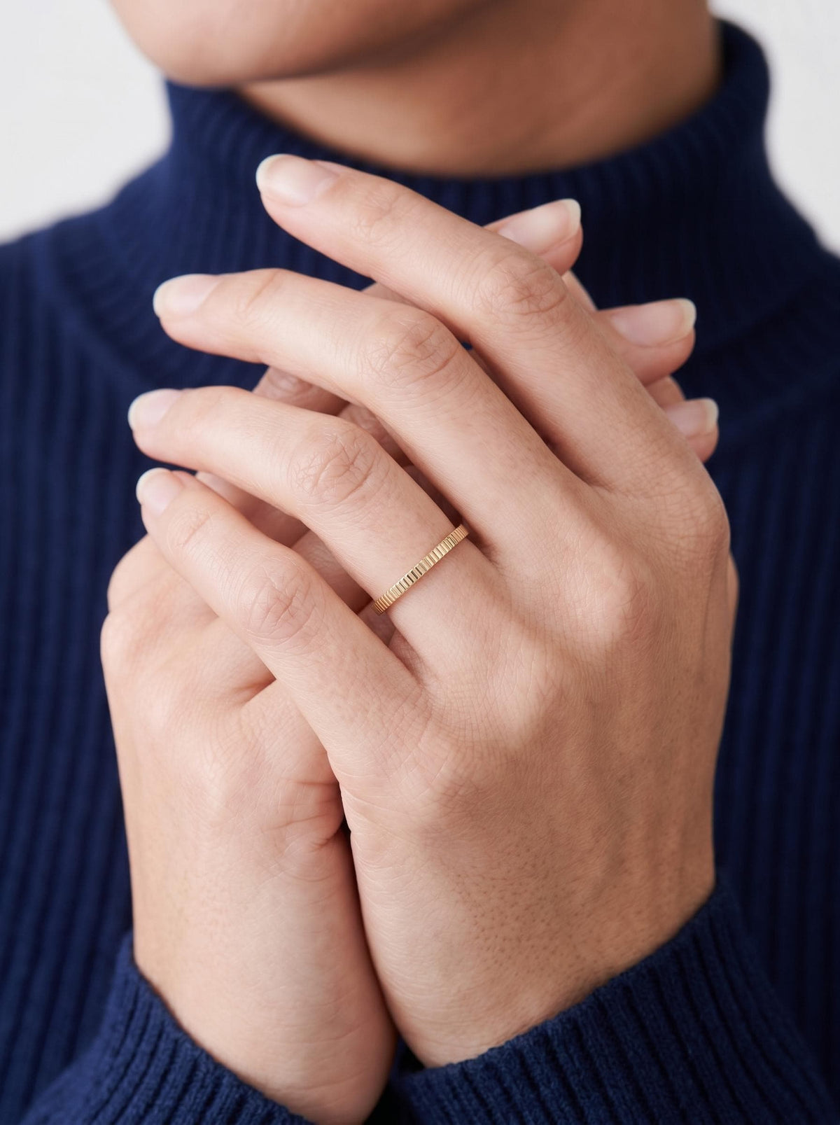 Ribbed band on clasped hands