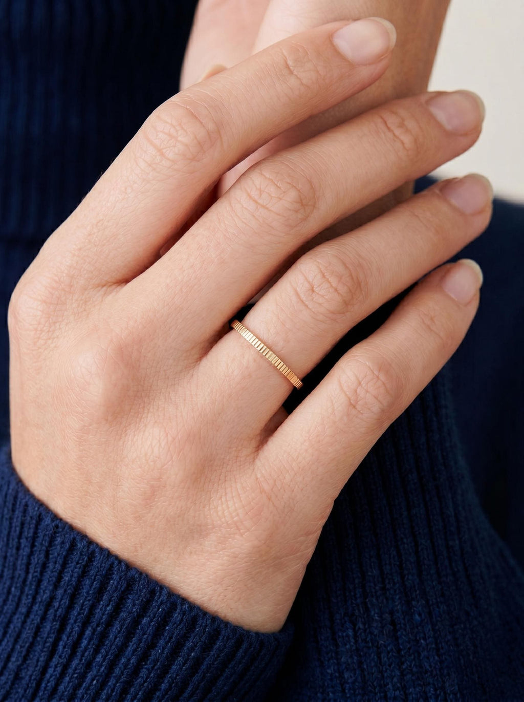 Minimalist ribbed band worn