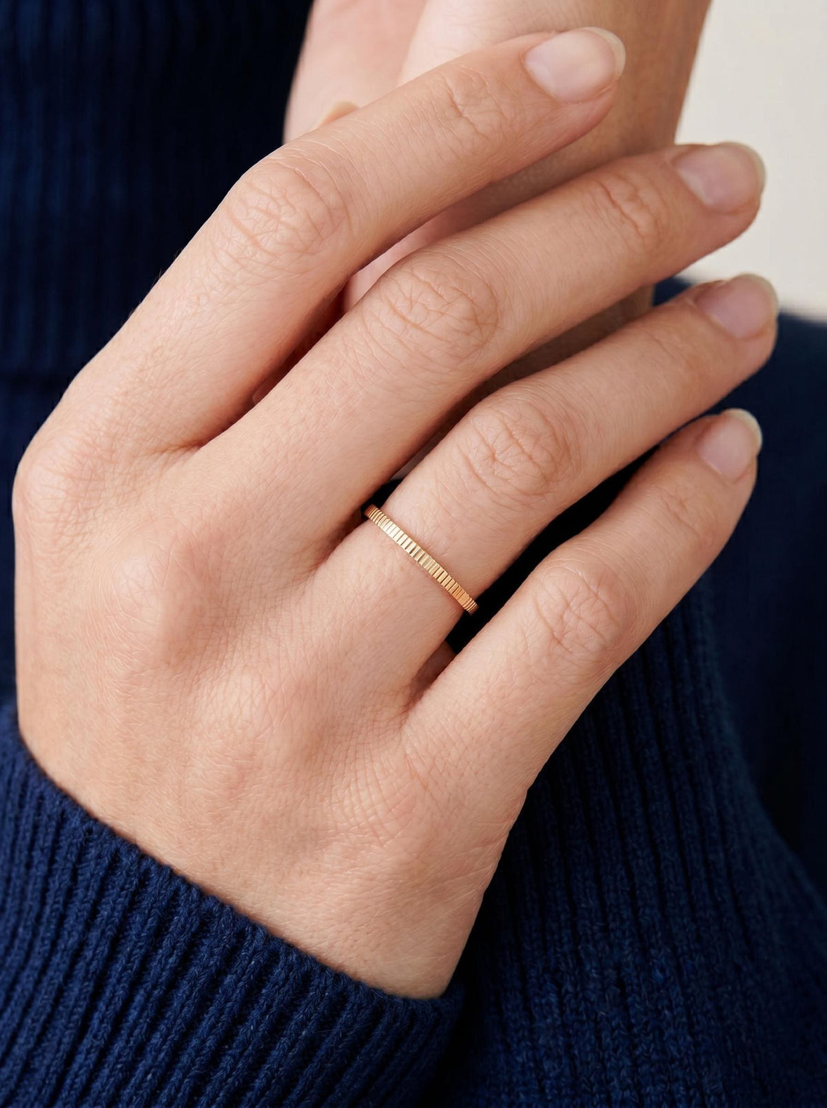 Minimalist ribbed band worn